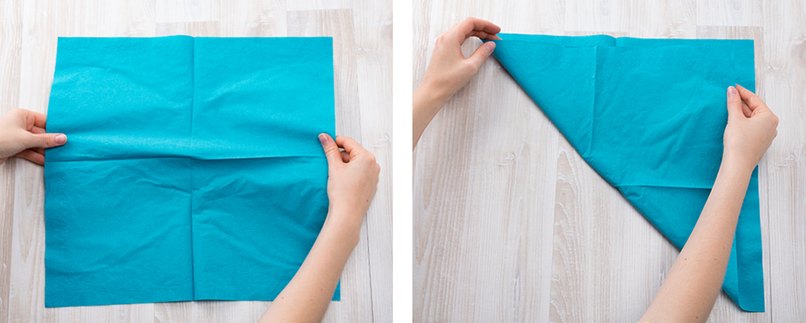 Türkisfarbene Serviette wird gefaltet