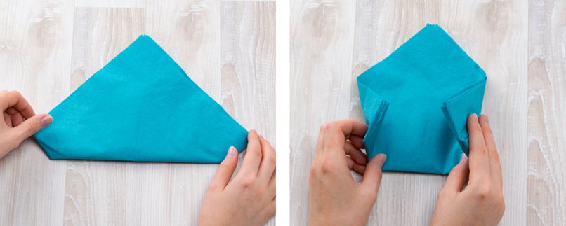 Türkisfarbene Serviette wird gefaltet