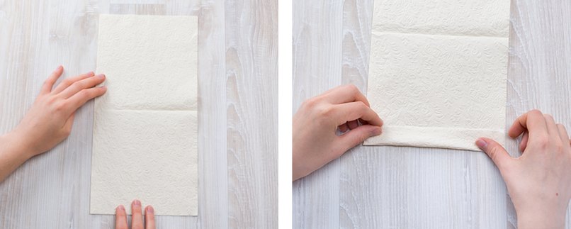 Serviette auf- und anschließend die untere Kante von unten nach oben falten.