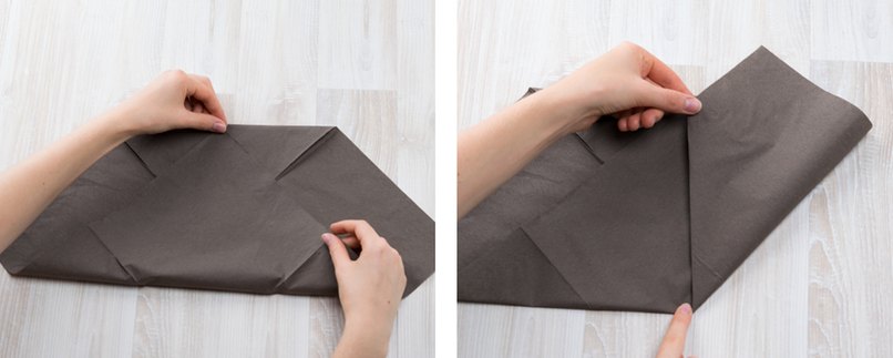 Braune Serviette wird gefaltet.