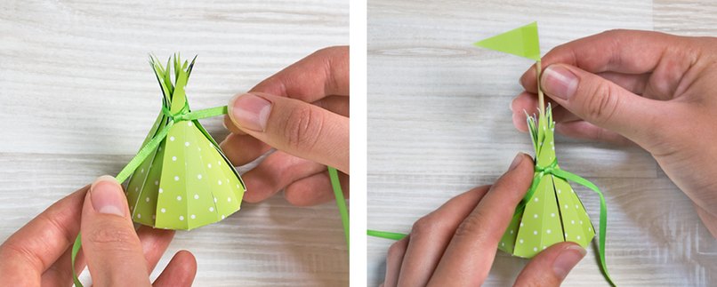 Schritt 7: Zubinden des Geschenkes Schritt 8: Geschenk mit Fähnchen verzieren Geschenk mit einem Bändchen verschließen. Optional kann ein Zahnstocher-Fähnchen in die Mitte gesteckt werden.